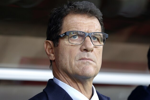 Russia’s team coach Fabio Capello looks at his team prior to a Euro 2016 Group G qualifying round soccer match between Russia and Moldova at the Otkrytie Arena of Spartak Moscow soccer club in Moscow, Russia, Sunday, Oct. 12, 2014. (AP Photo/Alexander Zemlianichenko)