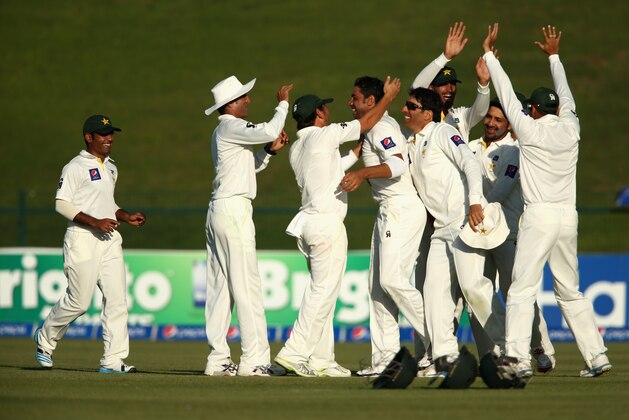 ABU DHABI, UNITED ARAB EMIRATES - NOVEMBER 12:  Imran Khan of Pakistan celebrates bowling Corey Anderson of New Zealand lbw during day four of the first test between Pakistan and New Zealand at Sheikh Zayed Stadium on November 12, 2014 in Abu Dhabi, United Arab Emirates.  (Photo by Warren Little/Getty Images)