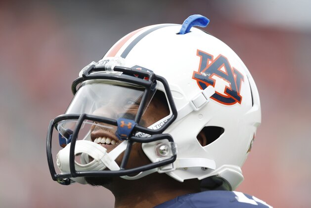 Auburn quarterback Nick Marshall (14) warms up before an NCAA college football game against Texas A&M, Saturday, Nov. 8, 2014, in Auburn, Ala. (AP Photo/Brynn Anderson)