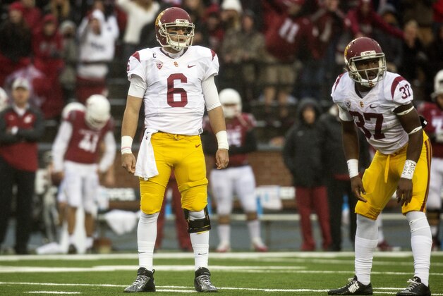 Southern California quarterback Cody Kessler (6) and tailback Javorius Allen (37) look to the bench before running a 4th down play against Washington State during the first quarter of an NCAA college football game Saturday, Nov. 1, 2014, at Martin Stadium in Pullman, Wash. Southern California won 44-17. (AP Photo/Dean Hare)