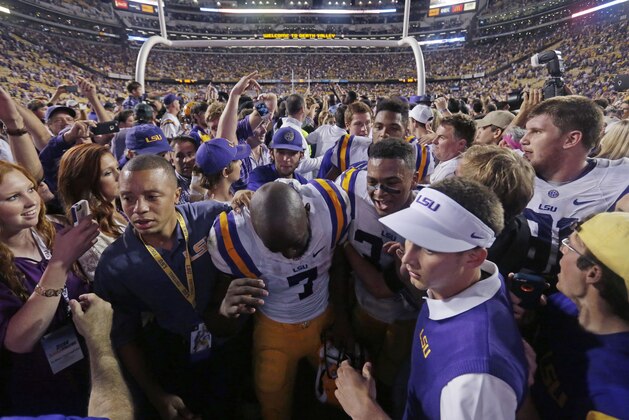 LSU running back Leonard Fournette (7) leaves the field after their victory over Mississippi in an NCAA college football game in Baton Rouge, La., Saturday, Oct. 25, 2014. LSU won 10-7. (AP Photo/Gerald Herbert)