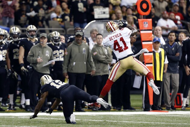 San Francisco 49ers strong safety Antoine Bethea (41) intercepts a pass intended for New Orleans Saints wide receiver Marques Colston (12) in the first half of an NFL football game in New Orleans, Sunday, Nov. 9, 2014. (AP Photo/Jonathan Bachman)