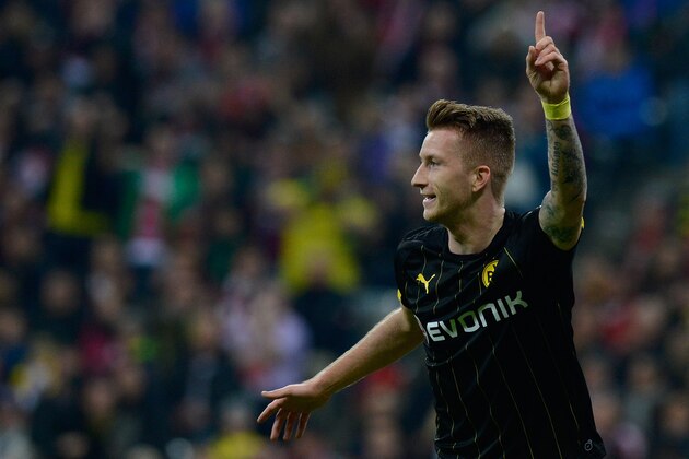 MUNICH, GERMANY - NOVEMBER 01:  Marco Reus of Dortmund celebrates his team's first goal during the Bundesliga match between FC Bayern Muenchen and Borussia Dortmund at Allianz Arena on November 1, 2014 in Munich, Germany.  (Photo by Daniel Kopatsch/Getty Images for MAN)