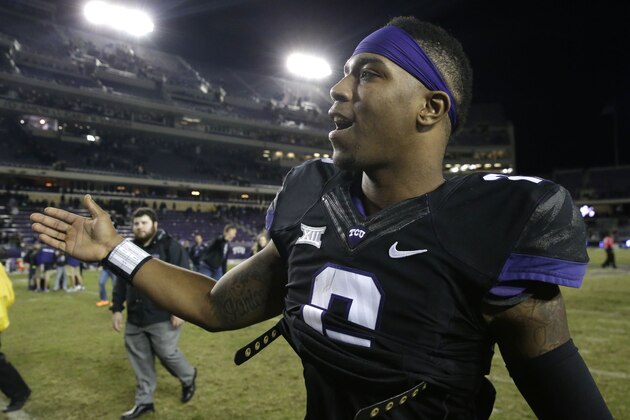 TCU quarterback Trevone Boykin is congratulated as he walks off the field after an NCAA college football game against Kansas State on Saturday, Nov. 8, 2014, in Fort Worth, Texas. TCU 41-20. (AP Photo/LM Otero)