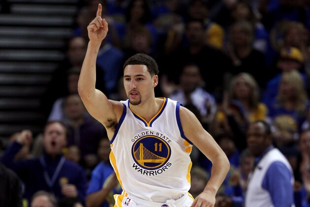 OAKLAND, CA - NOVEMBER 01:  Klay Thompson #11 of the Golden State Warriors reacts after making a basket against the Los Angeles Lakers at ORACLE Arena on November 1, 2014 in Oakland, California. NOTE TO USER: User expressly acknowledges and agrees that, by downloading and or using this photograph, User is consenting to the terms and conditions of the Getty Images License Agreement.  (Photo by Ezra Shaw/Getty Images)
