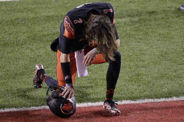 Utah quarterback Travis Wilson (7) takes a knee before the start of their NCAA college football game against Oregon Saturday, Nov. 8, 2014, in Salt Lake City. (AP Photo/Rick Bowmer)