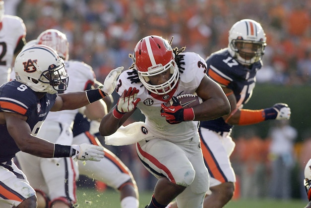 Nov 16, 2013; Auburn, AL, USA; Georgia Bulldogs running back Todd Gurley (3) is tackled by Auburn Tigers defensive back Jermaine Whitehead (9) during the first half against at Jordan Hare Stadium. Mandatory Credit: John Reed-USA TODAY Sports