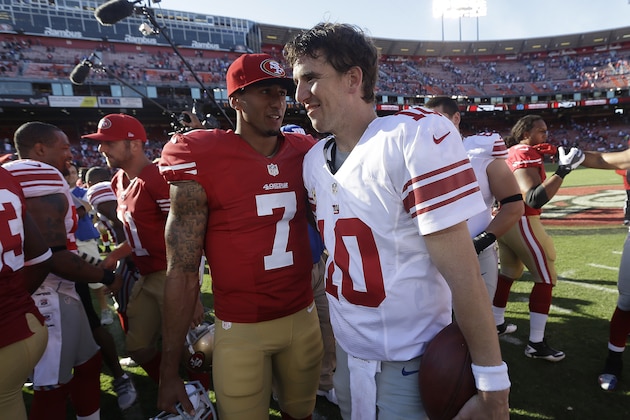 New York Giants quarterback Eli Manning (10) talks with San Francisco 49ers quarterback Colin Kaepernick (7) after an NFL football game in San Francisco, Sunday, Oct. 14, 2012. (AP Photo/Marcio Jose Sanchez)