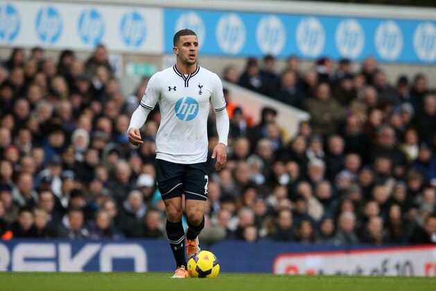 Tottenham's Kyle Walker takes the ball forward during the English Premier League soccer match between Tottenham Hotspur and Everton at the White Hart Lane stadium in London, Sunday, Feb. 9, 2014. (AP Photo/Alastair Grant)