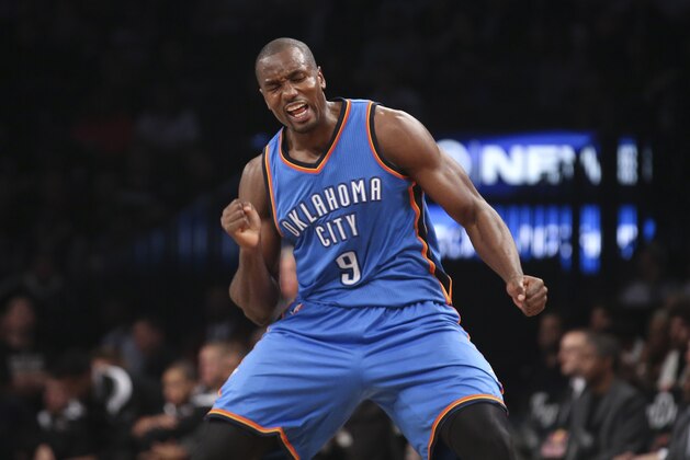 Oklahoma City Thunder forward Serge Ibaka (9) reacts in the second half of an NBA basketball game against the Brooklyn Nets, Monday, Nov. 3, 2014, in New York. The Nets won 116-85. (AP Photo/John Minchillo)