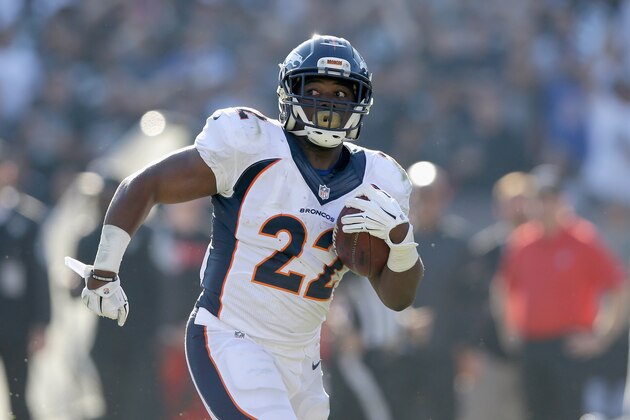 OAKLAND, CA - NOVEMBER 09:  C.J. Anderson #22 of the Denver Broncos carries for a touchdown in the first half against the Oakland Raiders at O.co Coliseum on November 9, 2014 in Oakland, California.  (Photo by Ezra Shaw/Getty Images)