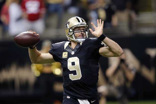 New Orleans Saints quarterback Drew Brees (9) drops back to pass in the first half of an NFL football game in New Orleans, Sunday, Nov. 9, 2014. (AP Photo/Bill Haber)