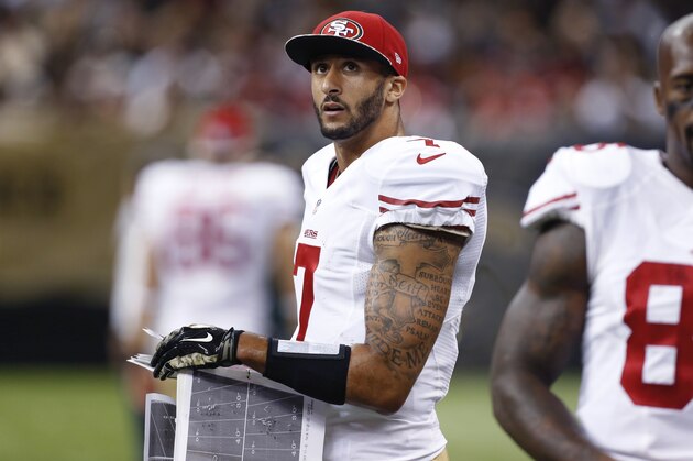 San Francisco 49ers quarterback Colin Kaepernick (7) watches from the sideline in the second half of an NFL football game against the New Orleans Saints in New Orleans, Sunday, Nov. 9, 2014. (AP Photo/Jonathan Bachman)