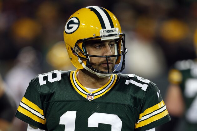 Green Bay Packers quarterback Aaron Rodgers (12) walks off to the sideline during the second half of an NFL football game against the Chicago Bears Sunday, Nov. 9, 2014, in Green Bay, Wis. (AP Photo/Mike Roemer)