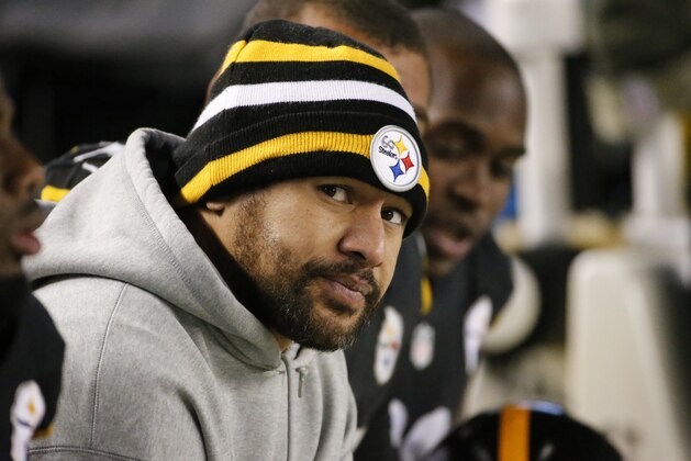 Pittsburgh Steelers strong safety Troy Polamalu sits on the sideline in a sweat suit during the second half of an NFL football game between the Pittsburgh Steelers and the Baltimore Ravens, Sunday, Nov. 2, 2014, in Pittsburgh. Polamalu was injured in the first  half of the game. The Steelers won 43-23. (AP Photo/Gene J. Puskar)