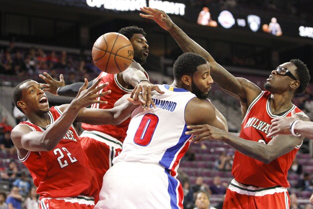 Oct 9, 2014; Auburn Hills, MI, USA; Detroit Pistons center Andre Drummond (0) gets surrounded by Milwaukee Bucks forward Khris Middleton (22) center Larry Sanders (8) and guard O.J. Mayo (00) during the third quarter at The Palace of Auburn Hills. Mandatory Credit: Raj Mehta-USA TODAY Sports
