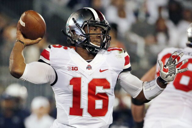 Ohio State quarterback J.T. Barrett (16) throws a pass during the fourth quarter of an NCAA college football game against Penn State in State College, Pa., Saturday, Oct. 25, 2014. Ohio State won 31-24. (AP Photo/Gene J. Puskar)