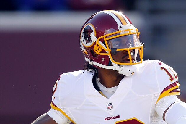 Washington Redskins quarterback Robert Griffin III (10) throws the ball against the Minnesota Vikings during an NFL football game, Sunday, Nov. 2, 2014, in Minneapolis. (Jeff Haynes/AP Images for Panini)