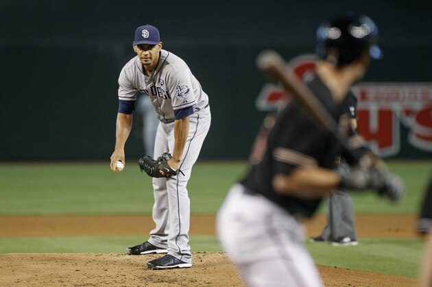 PHOENIX, AZ - SEPTEMBER 13:  Starting pitcher Tyson Ross #38 of the San Diego Padres prepares to throw a pitch against the Arizona Diamondbacks during the second inning of a MLB game at Chase Field on September 13, 2014 in Phoenix, Arizona.  (Photo by Ralph Freso/Getty Images)