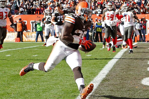 Nov 2, 2014; Cleveland, OH, USA; Cleveland Browns running back Terrance West (28) scores a touchdown against the Tampa Bay Buccaneers during the third quarter at FirstEnergy Stadium. The Browns won 22-17. Mandatory Credit: Ron Schwane-USA TODAY Sports