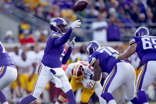 Minnesota Vikings quarterback Teddy Bridgewater (5) throws a pass against the Washington Redskins during an NFL football game, Sunday, Nov. 2, 2014, in Minneapolis. (Jeff Haynes/AP Images for Panini)