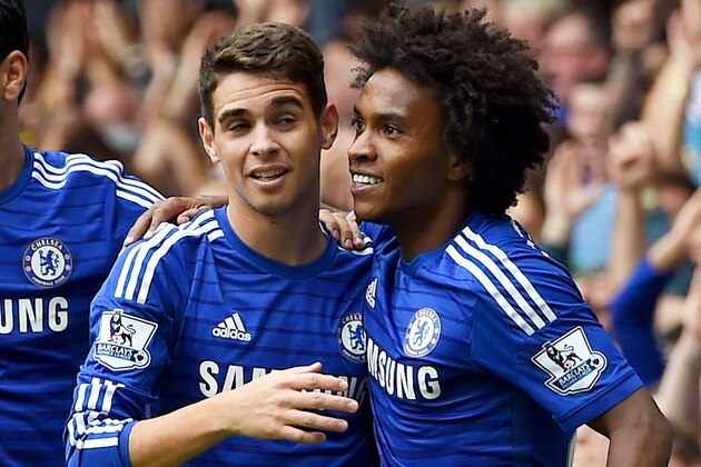 Chelsea’s Oscar, centre, celebrates scoring his teams' first goal, with Chelsea’s Diego Costa, left, and Chelsea’s Willian, who both later scored a goal each, during their English Premier League soccer match against Aston Villa at Stamford Bridge, London, Saturday, Sept. 27, 2014. (AP Photo/Tim Ireland)