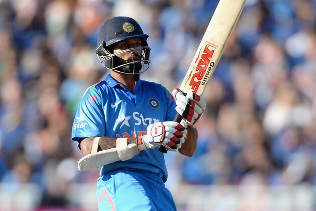 BIRMINGHAM, ENGLAND - SEPTEMBER 07:  Shikhar Dhawan of India hits out for six runs during the NatWest International T20 between England and India at Edgbaston on September 7, 2014 in Birmingham, England.  (Photo by Gareth Copley/Getty Images)