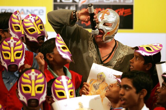 World Wrestling Entertainment star Rey Mysterio interacts with school children in Mumbai, India, Tuesday, March 13, 2007. Ray urged children to study and become good human beings. (AP Photo/Rajesh Nirgude)