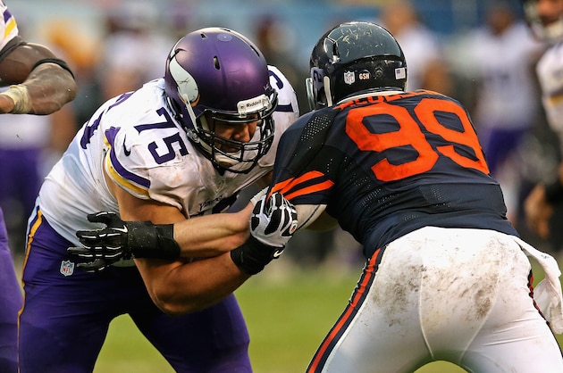 CHICAGO, IL - SEPTEMBER 15: Matt Kalil #75 of the Minnesota Vikings blocks Shea McClellin #99 of the Chicago Bears at Soldier Field on September 15, 2013 in Chicago, Illinois. The Bears defeated the Vikings 31-30. (Photo by Jonathan Daniel/Getty Images)