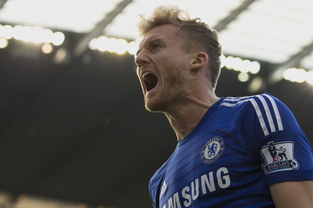 Chelsea's Andre Schuerrle celebrates after scoring against Manchester City during their English Premier League soccer match at the Etihad Stadium, Manchester, England, Sunday Sept. 21, 2014. (AP Photo/Jon Super)
