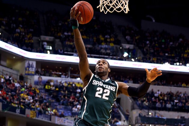 INDIANAPOLIS, IN - MARCH 16:  Branden Dawson #22 of the Michigan State Spartans goes to the basket against the Michigan Wolverines during the 2014 Big Ten Men's Championship at Bankers Life Fieldhouse on March 16, 2014 in Indianapolis, Indiana.  (Photo by Andy Lyons/Getty Images)