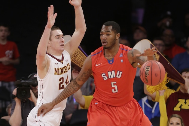 SMU's Markus Kennedy (5) works against Minnesota's Joey King (24) during the first half of an NCAA college basketball game in the final of the NIT on Thursday, April 3, 2014, in New York. (AP Photo/Frank Franklin II)