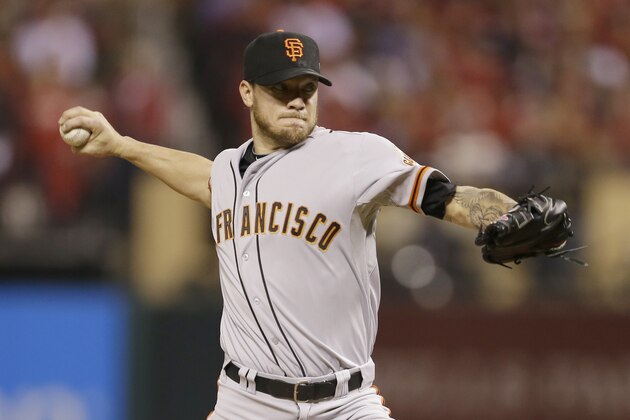 San Francisco Giants starting pitcher Jake Peavy throws during the second inning in Game 2 of the National League baseball championship series against the St. Louis Cardinals Sunday, Oct. 12, 2014, in St. Louis. (AP Photo/Jeff Roberson)