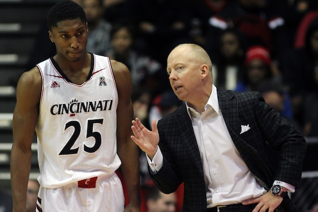 Cincinnati's coach Mick Cronin talks with player Kevin Johnson as they play Fairmont State in the second half of an NCAA college basketball exhibition game in Cincinnati, Saturday, Nov. 8, 2014. (AP Photo/Tom Uhlman)