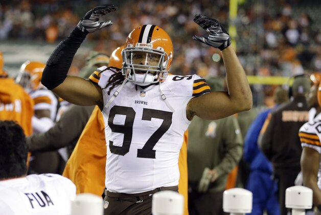 Cleveland Browns outside linebacker Jabaal Sheard (97) celebrates after a 24-3 win over the Cleveland Browns in an NFL football game Thursday, Nov. 6, 2014, in Cincinnati. (AP Photo/Michael Conroy)