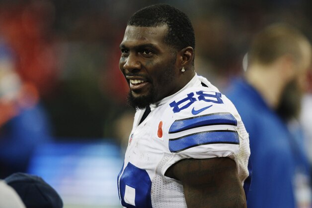 Dallas Cowboys wide receiver Dez Bryant stands on the sidelines during the second half of an NFL football game against the Jacksonville Jaguars at Wembley Stadium, London, Sunday, Nov. 9, 2014. The Cowboys defeated the Jaguars 31-17. (AP Photo/Matt Dunham)