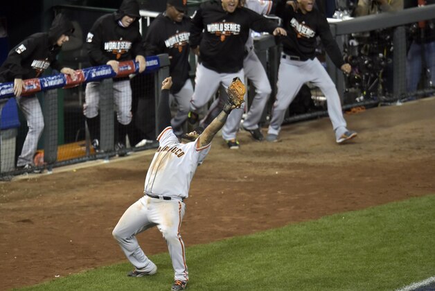 Oct 29, 2014; Kansas City, MO, USA; San Francisco Giants third baseman Pablo Sandoval celebrates after catching a pop out for the final out of game seven of the 2014 World Series against the Kansas City Royals  at Kauffman Stadium. Mandatory Credit: Denny Medley-USA TODAY Sports