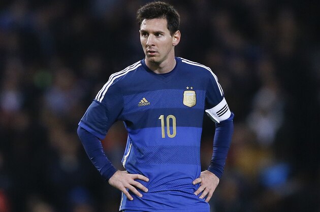 Argentina's Lionel Messi stands during the international friendly soccer match between Argentina and Croatia at the Boleyn Ground in London, Wednesday, Nov. 12, 2014. (AP Photo/Kirsty Wigglesworth)