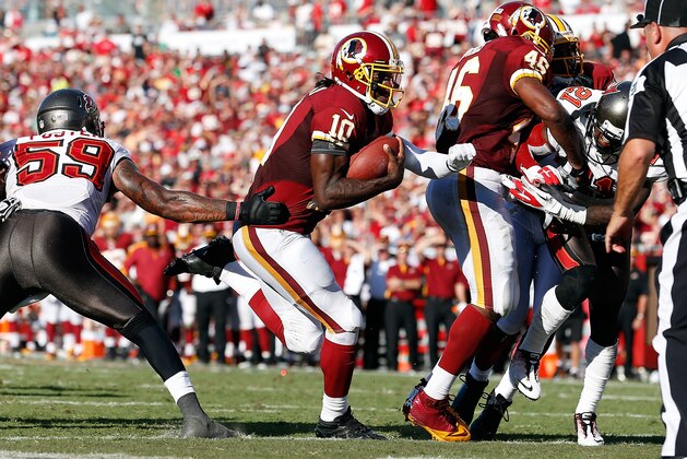 TAMPA, FL - SEPTEMBER 30:  Quarterback Robert Griffin III #10 of the Washington Redskins scores against the Tampa Bay Buccaneers during the game at Raymond James Stadium on September 30, 2012 in Tampa, Florida.  (Photo by J. Meric/Getty Images)