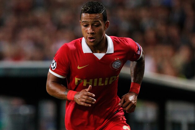 EINDHOVEN, NETHERLANDS - AUGUST 20:  Memphis Depay of PSV in action during the UEFA Champions League Play-off First Leg match between PSV Eindhoven and AC Milan at PSV Stadion on August 20, 2013 in Eindhoven, Netherlands.  (Photo by Dean Mouhtaropoulos/Getty Images)