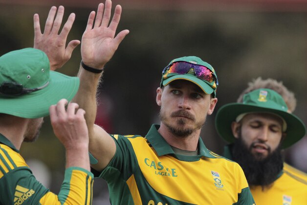 FILE - In this Sept. 4, 2014 file photo, South African players Dale Steyn, center, and AB de Villiers, left, celebrate after their win in the  cricket One Day International against Zimbabwe in Harare, Zimbabwe. South Africa and Australia will resume a their increasingly antagonistic rivalry in a five-match one-day cricket series starting Friday, Nov. 14, 2014 which which will bolster the winner's confidence ahead of next year's World Cup. South Africa fast bowler Dale Steyn and Australia captain Michael Clarke clashed angrily during the third test at Cape Town in March and ill-feeling over that incident resurfaced when the teams met in a tri-series in Zimbabwe in September. (AP Photo/Tsvangirayi Mukwazhi, File)