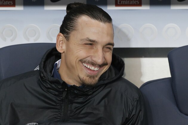 Paris Saint Germain's Zlatan Ibrahimovic smiles as he sits on the bench during the first half of to their French League One soccer match between Paris Saint Germain and Marseille at Parc des Princes stadium in Paris, Sunday, Nov. 9, 2014.  Zlatan Ibrahimovic resumed full training  following a heel injury, stepping up his bid to be ready to face Marseille in the French league table-topping clash. (AP Photo/Francois Mori)