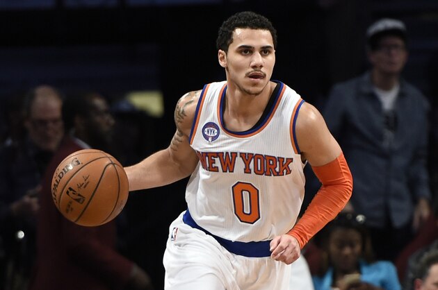 New York Knicks guard Shane Larkin (0) drives the ball down court against the Brooklyn Nets during an NBA basketball game on Friday, Nov. 7, 2014 at Barclays Center in New York. (AP Photo/Kathy Kmonicek)