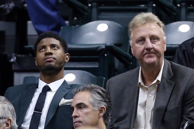 Oct 7, 2014; Indianapolis, IN, USA; Indiana Pacers forward Paul George  sits next to Indiana president Larry Bird during the game against the Minnesota Timberwolves at Bankers Life Fieldhouse. Mandatory Credit: Brian Spurlock-USA TODAY Sports
