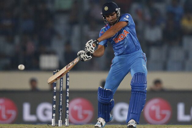 India's batsman Rohit Sharma plays a shot during their ICC Twenty20 Cricket World Cup match against West Indies' in Dhaka, Bangladesh, Sunday, March 23, 2014. (AP Photo/Aijaz Rahi)