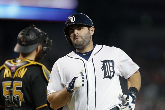 Detroit Tigers' Alex Avila reaches home plate after his solo home run during the fifth inning of an interleague baseball game against the Pittsburgh Pirates, Wednesday, Aug. 13, 2014 in Detroit. (AP Photo/Carlos Osorio)