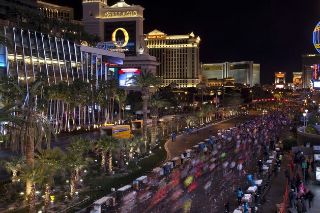 Runners stream southward on Las Vegas Boulevard during the Rock 'n Roll Las Vegas Marathon, Sunday, Dec. 4, 2011, in Las Vegas. Forty five thousand participants ran in a marathon and half marathon filling the shut-down Strip. (AP Photo/Julie Jacobson)