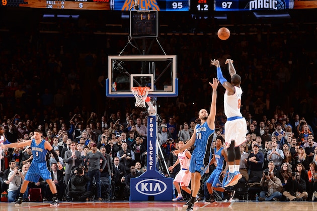NEW YORK, NY -  NOVEMBER 12: J.R. Smith #8 of the New York Knicks shoots against Evan Fournier #10 of the Orlando Magic during the game on November 12, 2014 at Madison Square Garden in New York, NY. NOTE TO USER: User expressly acknowledges and agrees that, by downloading and or using this Photograph, user is consenting to the terms and conditions of the Getty Images License Agreement. Mandatory Copyright Notice: Copyright 2014 NBAE (Photo by Jesse Garrabrant/NBAE via Getty Images)