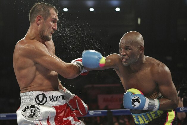Bernard Hopkins of Philadelphia, PA, right, punches Sergey Kovalev of Russia during the 12th round of the Main Event IBF, WBA and WBO Light Heavyweight Titles boxing in Atlantic City, N.J. on Saturday, Nov. 8, 2014. Kovalev won by TKO in the 12th round. (AP Photo/Tim Larsen)