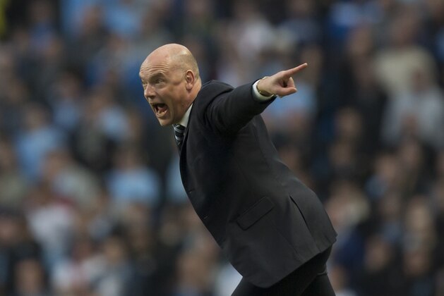 Wigan Athletic's manager Uwe Rosler issues instructions as his team beat Manchester City 2-1 during their English FA Cup quarterfinal soccer match at the Etihad Stadium, Manchester, England, Sunday March 9, 2014. (AP Photo/Jon Super)